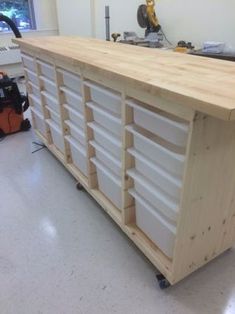 a large wooden counter with drawers on it