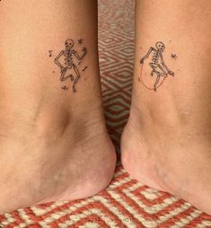 two people with matching tattoos on their feet, one has a skeleton and the other has a star