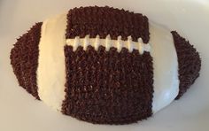 a cake shaped like a football on top of a white plate