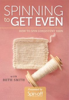 the book cover for spinning to get even, with yarn and spools on it