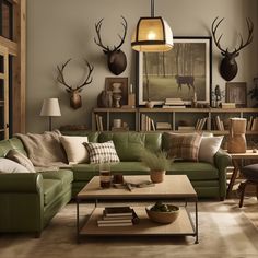 a living room with green couches and deer head mounted on the wall above them