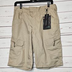 Esdy Tactical Shorts. Khaki Tan. Velcro Waist Closure. Multi Functional Pockets: Front Slant Pockets. Side Cargo Pockets With Velcro And Zipper Closure. Back Velcro Pockets. Elastic At Back Of Waist. Nwt. 65% Polyester 35% Cotton. Size Large. (Runs Small Please See Measurements) Flat Lay Measurements: Waist 16" Rise 12" Inseam 11" Overall Length 21" (Waist To Hem) Aa712 Tactical Outdoor Shorts With Cargo Pockets, Tactical Shorts With Side Pockets For Outdoor, Tactical Shorts With Pockets For Outdoor Activities, Tactical Cargo Shorts For Outdoor, Tactical Cargo Shorts With Side Pockets For Outdoor Activities, Combat Cargo Shorts For Outdoor, Khaki Cargo Shorts For Outdoor Work, Combat Shorts With Pockets For Outdoor, Combat Style Outdoor Shorts With Pockets