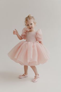 Introducing the Maria Kids Dress: a delightful blush pink flower girl dress crafted from delicate puff organza, perfect for making your little one feel like a princess. This charming dress is designed with attention to detail, ensuring both comfort and style for any special occasion. The Maria Kids Dress features adora Organza Baby Frocks, Organza Dress For Kids, Organza Frocks For Kids, Modern Flower Girl Dress, Party Dress For Kids, Organza Flower Girl Dress, Blush Flower Girl Dresses, Pink Flower Girl Dresses