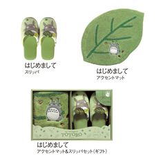 an assortment of green shoes with totoro on the front and back, including slippers