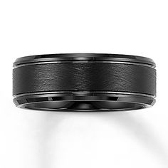 a wedding band with black ceramic inlay