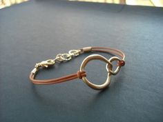 "simple modern bracelet made with 16K gold plated double curb link and marigold leather cord double curb link measures 33mm matching necklace; https://www.etsy.com/listing/115808849/personalized-double-curb-lariat-light https://www.etsy.com/listing/71229778/double-curb-link-necklace-matte-16k-gold matching earrings; https://www.etsy.com/listing/71230263/double-curb-link-earrings-matte-16k-gold also available in white gold; https://www.etsy.com/listing/62858505/double-curb-link-bracelet bracelet Minimalist Adjustable Jewelry With Jump Ring, Modern Handmade Jewelry For Everyday Use, Elegant Brown Personalized Jewelry, Elegant Everyday Bracelet Jewelry, Elegant Everyday Jewelry Bracelet, Everyday Brown Metal Jewelry, Modern Bracelet, Modern Bracelets, Link Earrings