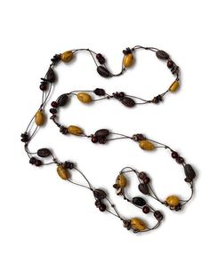 Ecuadorean Tagua Jewelry - Eco Friendly Wrap around extra long necklace Color: Yellow, Brown Item Number: TAG633 Item Weight: 1.4oz Product Length: 50 inches long About Tagua This Product is handcrafted from a palm tree nut native to the lush tropical rain forests of Ecuador. Also referred to as the Ecuadorean Ivory Palm, the Tagua tree produces several bushels of seed pods a year with up to 100 Tagua nuts per pod. These nuts are then harvested, dried, and crafted into a wide range of products f Adjustable Yellow Lariat Necklace, Fair Trade Multi-strand Necklace As Gift, Fair Trade Multi-strand Jewelry As Gift, Fair Trade Multi-strand Necklace For Gift, Brown Lariat Necklace As Gift, Brown Long Lariat Necklace For Gift, Brown Long Lariat Necklace Gift, Adjustable Multi-strand Brown Long Necklace, Adjustable Brown Multi-strand Long Necklace