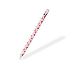 a pink pen with red hearts on it