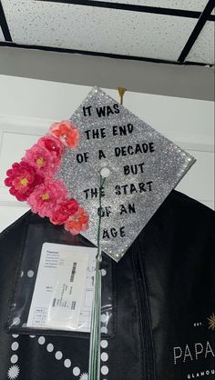 a graduation cap with flowers on it and the words it was the end of a decade, but the start of an age