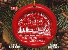 a red ornament hanging from a christmas tree with the words, the polar express believe for those who trust