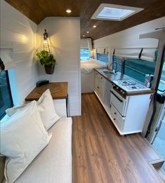 the interior of a tiny home with wood flooring