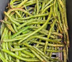 green beans are being cooked in a pan