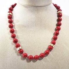 Red Beaded With Charms Ascent Women's Necklace. - FashionByTeresa Cheap Red Necklaces With Oval Beads, Luxury Red Beaded Necklaces With Spacer Beads, Luxury Red Beaded Necklaces With 8mm Beads, Cheap Red Beaded Necklace For Statement, Luxury Red Hand-strung Beaded Necklaces, Cheap Traditional Red Beaded Necklace, Luxury Hand-strung Red Beaded Necklace, Cheap Adjustable Red Beaded Necklaces, Cheap Red Beaded Necklace