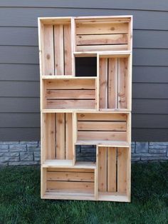 a book shelf made out of wooden crates