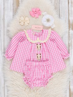 Get your little lady ready for a cute day out in our Pink Gingham Embroidered Horses Bloomers Outfit! Made from 100% cotton for comfort, this outfit features a playful pink gingham print and embroidered horses. The ruffle trim collar adds an extra touch of sweetness. Perfect for sisters to match! Fits true to size. 100% Cotton Accessories sold separately. Import. *Afterpay & Sezzle Purchase Requires $35 Minimum Order. Bloomers Outfit, Cotton Accessories, Embroidered Horse, Gingham Print, Ruffle Trim, Horses, Trim