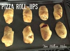 nine pieces of pizza roll - ups on a baking sheet