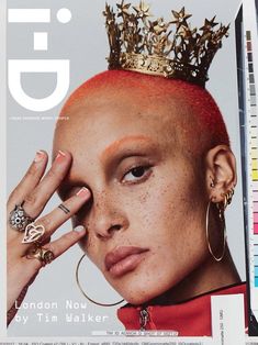 a woman with red hair wearing a crown on top of her head is featured in the cover of gq magazine