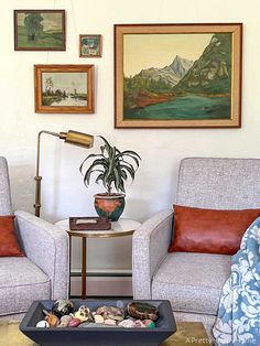 a living room with two chairs and a coffee table