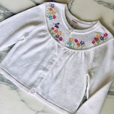 Nwt-New! White Sweater With Bright Colored Flowers And Butterflies Embroidered At The Collar/ Neckline. Embroidery On Front And Back. Cardigan Style With Buttons Down The Front. So Sweet For Fall Or Spring! Fitted White Cardigan With Floral Embroidery, Spring Cotton Cardigan For Playtime, White Cotton Cardigan With Floral Embroidery, Cute Embroidered Cotton Cardigan, Spring Embroidered White Cardigan, White Embroidered Spring Cardigan, White Embroidered Cardigan For Spring, Cute White Cotton Cardigan, White Embroidered Cotton Cardigan