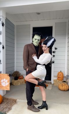 a man and woman dressed up in halloween costumes