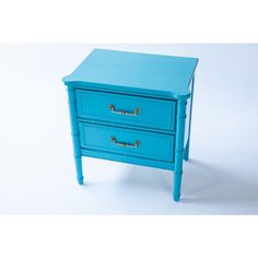 a small blue table with two drawers on each side and one drawer open to show the bottom