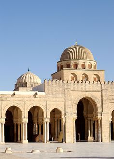 an old building with arches and domes on top