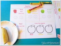 a paper plate with some crayons on it next to an apple themed activity sheet