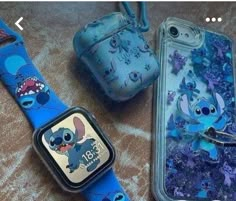 three cell phones and an apple watch with cartoon characters on them, sitting next to each other