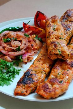 some meat and vegetables are on a white plate with parsley garnishes