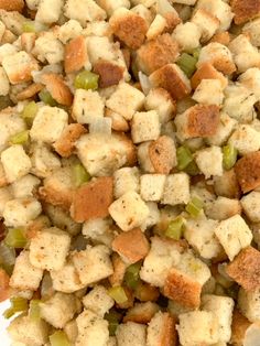 a close up view of some food on a white plate with broccoli and stuffing