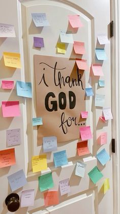 a bulletin board with post it notes attached to the front door that says, i thank god for you