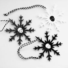 black and white paper snowflakes with twine