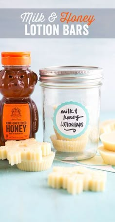 honey and honey lotion bars are sitting on a table next to a jar filled with honey