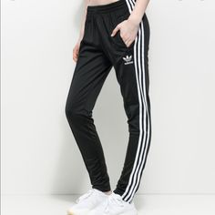 Brand New Adidas Black Track Pants Brand New With Tags! Color- Black Size- M Zipper At Ankle And Zipper Closure Pockets. Great Piece, Have The Jacket On Page For The Matching Set. Black Joggers With Three Stripes, Black Pants With Side Stripes For Spring, Spring Black Pants With Side Stripes, Black High Waist Joggers For Spring, High Waist Black Joggers For Spring, Black High-waist Joggers For Spring, Black Bottoms With Side Stripes For Spring, Spring Black Bottoms With Side Stripes, Fitted White Joggers