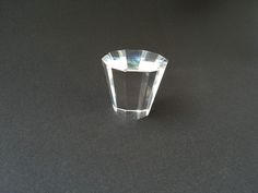 a clear diamond sitting on top of a black table