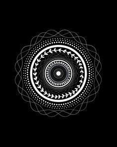 a black and white circular design on a dark background