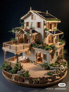 a wooden model of a house with plants on the balcony