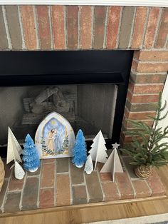 a fireplace decorated with blue and white decorations