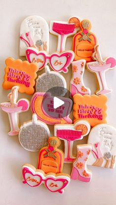 an assortment of decorated cookies in the shape of heart shapes with words and pictures on them