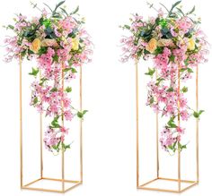 two gold stands with pink and yellow flowers on each side, one has green leaves