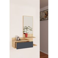 a shelf with a mirror and vase on it next to a wall mounted planter