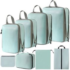 four pieces of luggage are shown in different colors