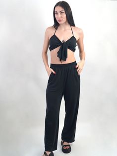 Your vacation is booked and these pants are definitely going. Relaxed pants you can dress up or down. Luxurious to the touch. Black pants with elastic waistband and pockets. This viscose is buttery soft and has a slight stretch. Designed to fit with a relaxed, straight fit through leg. Perfect for staying chic on the weekends. Pairs well with the matching bralette. Product Details: - 28" inseam - Elastic waistband - Pockets - Color: Black Composition & Care: - Material: 95% Viscose, 5% Spandex - Leg Care, Relaxed Pants, Relax Pants, Pitcairn Islands, Top Sales, Pull On Pants, British Indian, Mozambique, Brunei