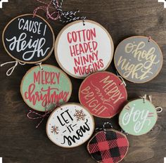 six christmas ornaments with handwritten words on them, including one for each ornament