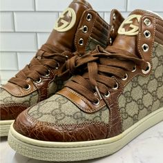 Elevate Your Sneaker Game With These Stunning Gucci Imprime High 'Crocodile Skin' Sneakers. Crafted From Premium Quality Leather, These High Top Sneakers Feature A Striking Crocodile Print That Adds A Touch Of Luxury To Any Outfit. The Brown Color And Gucci Branding Make These Sneakers A Must-Have For Any Fashion-Forward Woman. These Athletic Sneakers Are Perfect For Any Occasion, Whether You're Hitting The Gym Or Running Errands. With A Us Shoe Size Of 7.5, These Sneakers Are Designed To Fit Co Gucci Branding, Gucci Brand, Crocodile Print, Crocodile Skin, Sneaker Games, Athletic Sneakers, Gucci Shoes, Skin Color, Running Errands