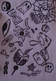 a bunch of doodles that are on top of a piece of paper with black ink