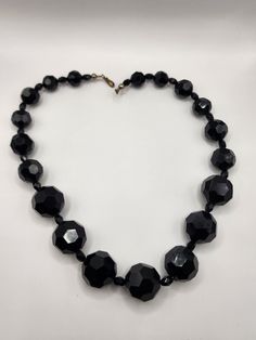 16" choker with hook closure. jet black faceted beads that are plastic. Has a heavy feel to it. Excellent condition and seems mid Century. Largest bead is about 3/4" Black Choker With Large Round Beads, Black Choker With Large Beads, Adjustable Black Choker With Large Beads, Black Faceted Beads Costume Jewelry Necklace, Black Faceted Beaded Necklaces, Black Faceted Round Beaded Necklaces, Alexandria Va, Beaded Necklaces, Acrylic Beads