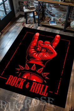 a rug with the word rock and roll written on it in front of a wooden floor