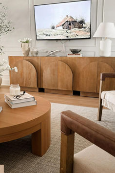 Meet our Iris console! Inside, discover a handy closed storage drawer and ample storage space tucked behind its distinctive arched cabinet doors. The interior shelves are adjustable, allowing you to customize the storage to your needs. Crafted from wood, the natural material adds warmth to your space, though it's important to note that natural wood can have variations in wood grain, making each piece one-of-a-kind. Arched Cabinet Doors, Large Console Table, Nathan James, Wood Arch, Interior Shelves, Rugs Usa, Wood Console, Cabinets For Sale, Tv Console