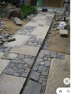 an image of a stone walkway being built